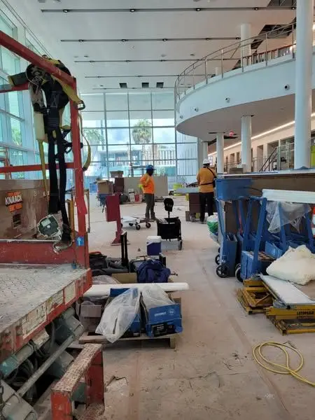 Atrium on an active job site with lifts and materials